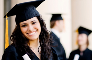 Woman wearing black graduation gown and cap